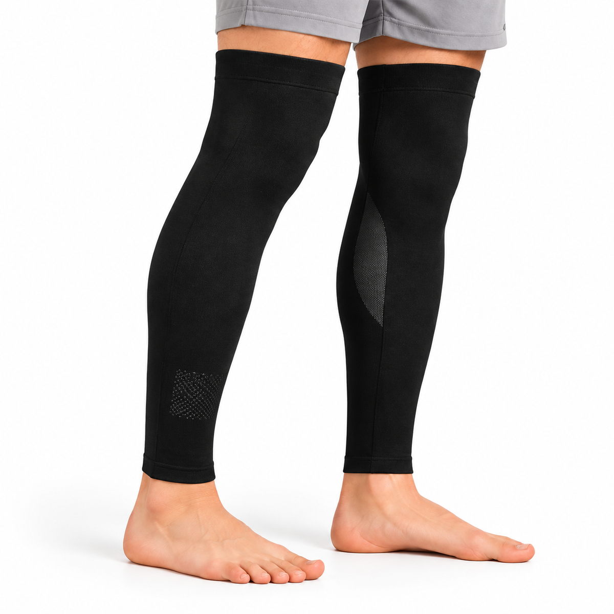 Long black leg sleeves worn from above the knees to the ankles.