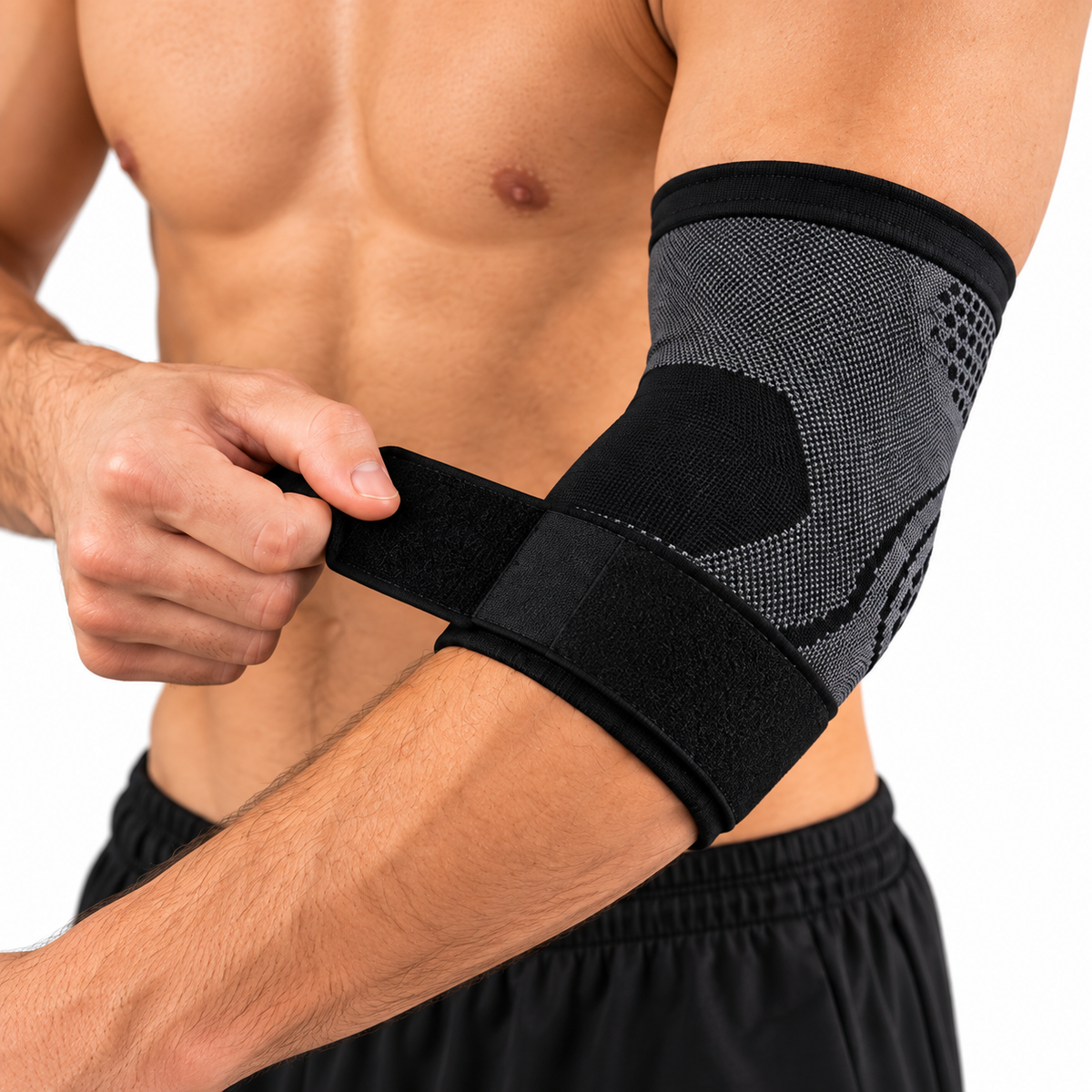 Person adjusting the black strap on an elbow sleeve.